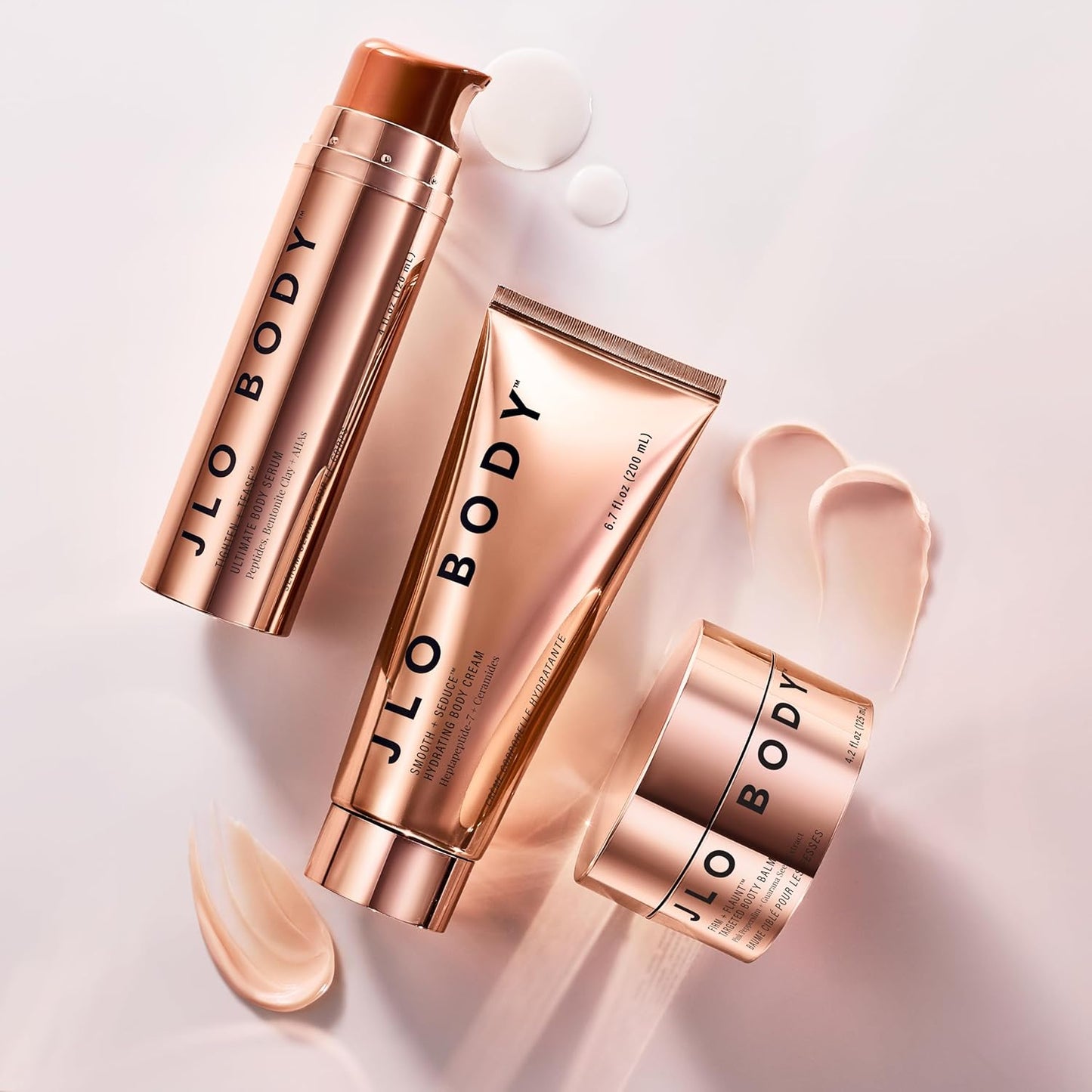 JLO BEAUTY The Ultimate Body Trio | Includes 4.2 fl oz Booty Balm, 4 fl oz Body Serum & 6.7 fl oz Body Cream | Brightens, & Firms for Smooth Skin